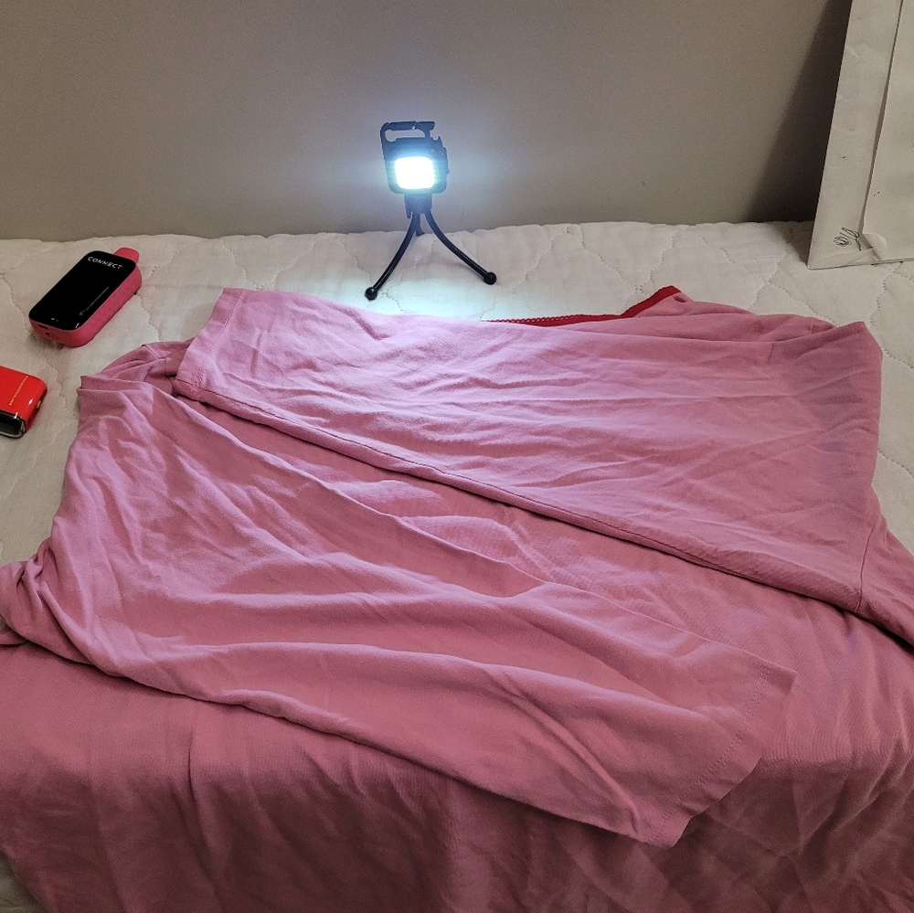 A woman"s 3X sleep wear top, pink with long sleeves.